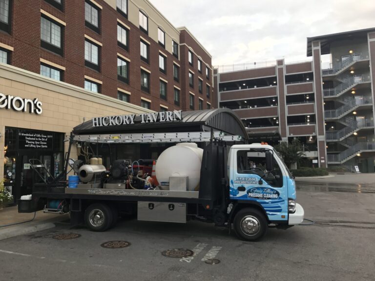 Hickory Tavern pressure washing exterior to remove dirt and stains.