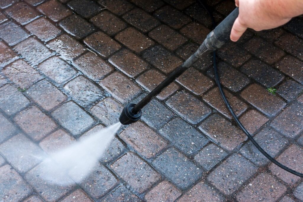 Pressure washing brick floor for deep cleaning
